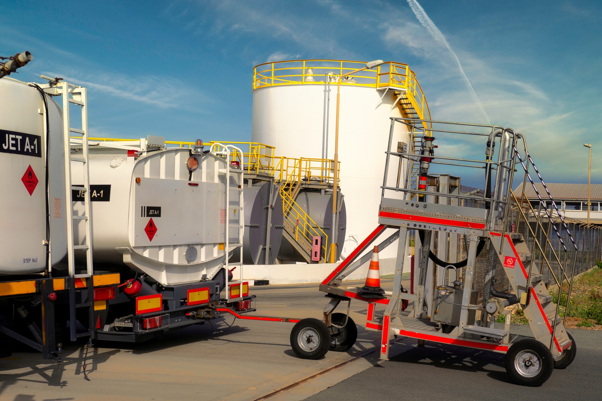 Fuel base of the international airport. Refueling vehicles with jet A-1 fuel. Trolley for supplying fuel hoses to aircraft wings. Fuel terminal with a system for the supply and distribution of aviation fuel.